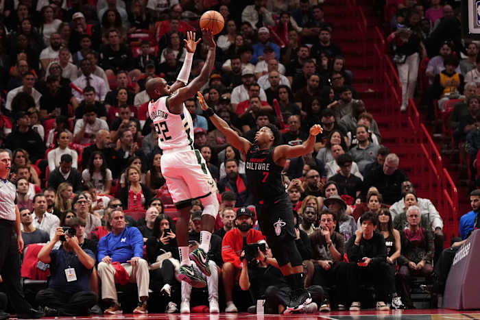 Milwaukee Bucks forward Khris Middleton (22) shoots over Miami Heat guard Kyle Lowry (7)